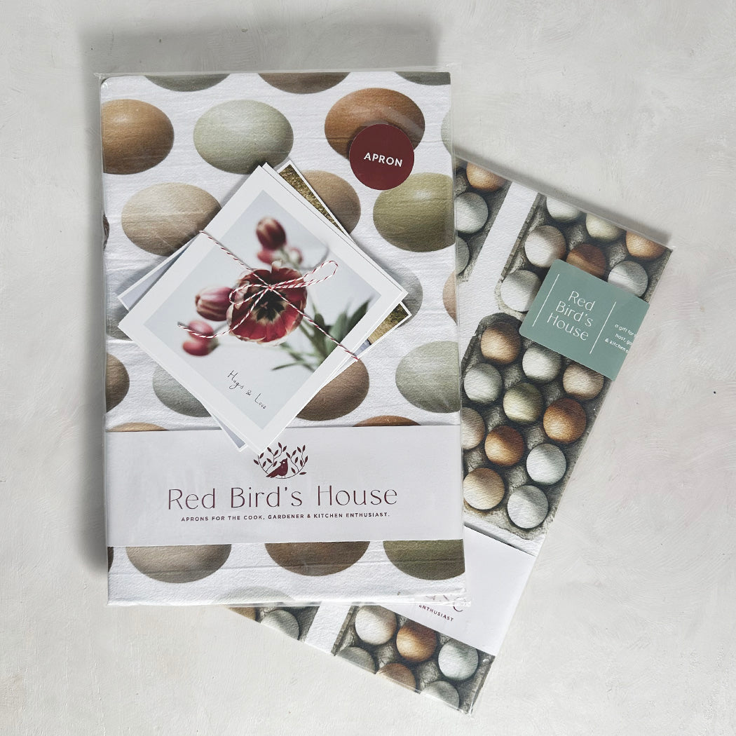 Farm eggs' beautiful tones and shape makes this set a favorite. A farm stule and still contempoirary look makes this set a wonderful gift for those cooks in your life.  A set includes 1 crossed apron and 1 kitchen towel by Red Bird's House