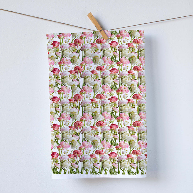 This kitchen towel features a lovely pattern of ranunculus in soothing tones, making it a delightful addition to any kitchen or a thoughtful gift.   Our dish towels are a perfect combination of style and practicality.  Size: 19"x 28" Print size 16"x18" 100%  Cotton Gift Ready Packed Machine wash  Exclusively at Red BIrd's House Copyright owned by Pauline Stevens.