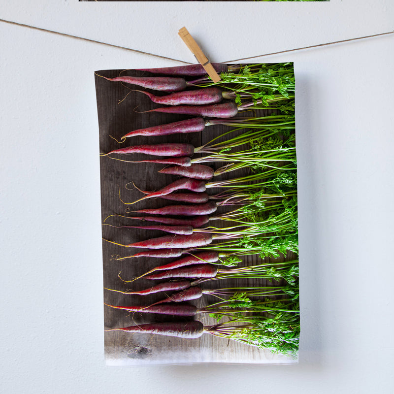 Red carrots on a cutting-board kitchen towel. Red carrots from farmers market. beautiful color carrots. Photography by Pauline Stevens. Hostess Gift. 19" x 28" (7891124846815)