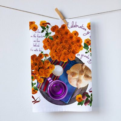 Ofrenda kitchen towel. Dia de los muertos is here. Ofrenda has bread cups and beautiful flower. As well as a touch of Mexican artisan items. Photography by Pauline Stevens. Hostess Gift, 19" x 28" (3730517721140)