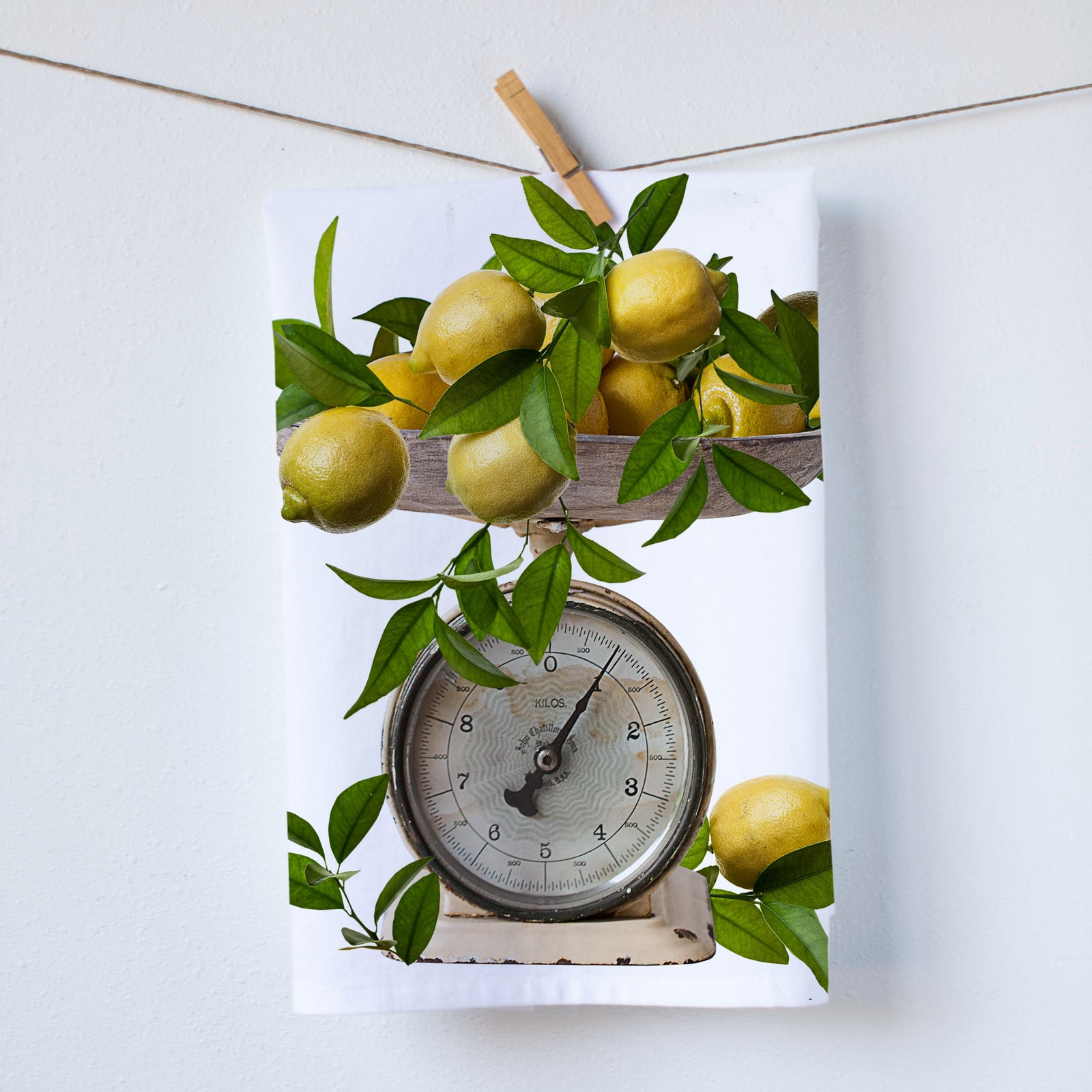 Vintage scale with lemons on top kitchen towel. Vintage scale from the 1920s with lemons overflowing the scale. Photography by Pauline Stevens. Hostess Gift. 19" x 28" (424006893)