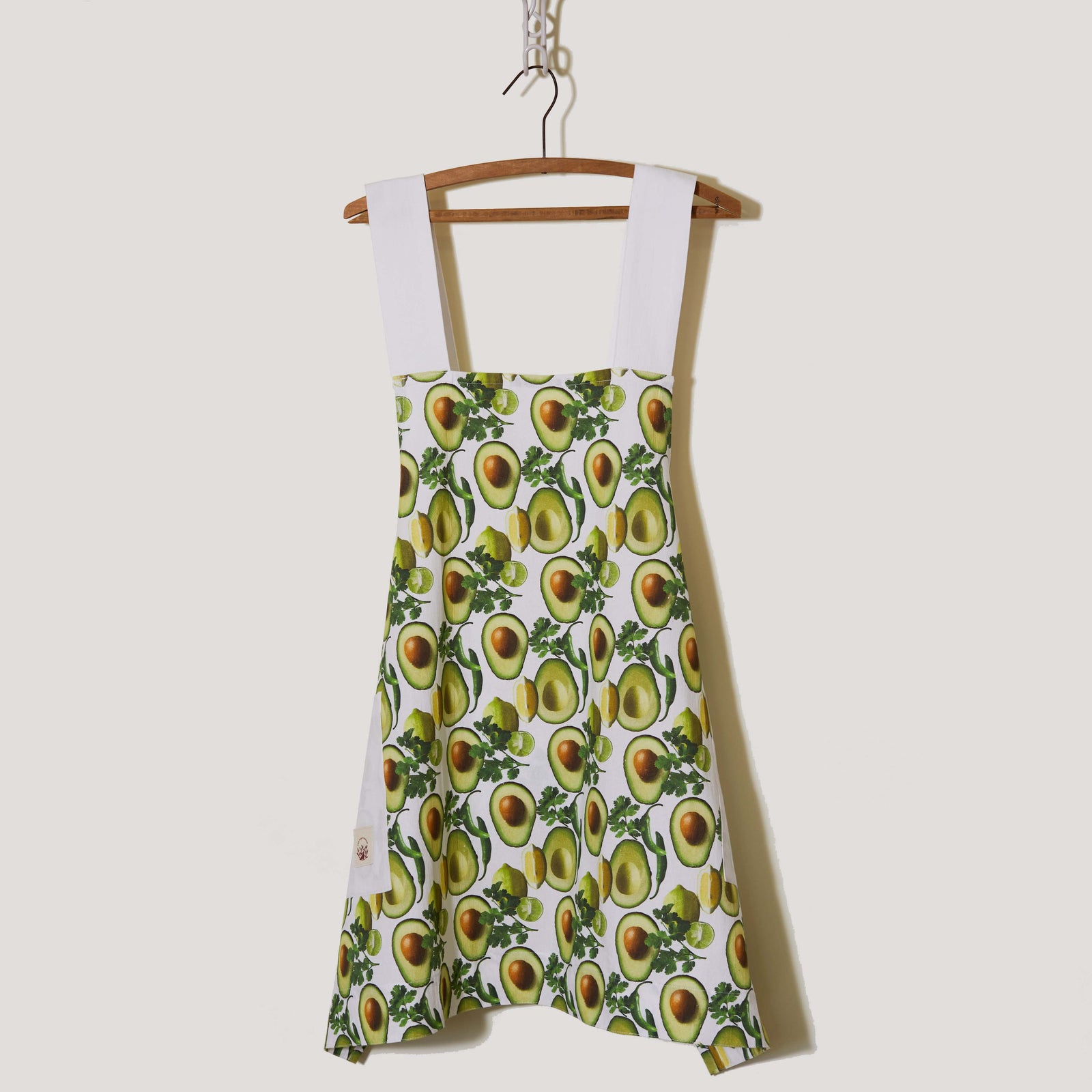 ntroducing our exquisite apron, crafted from 100% beautiful cotton, offering a luxurious feel while ensuring exceptional comfort. With its stylish crossed back design, this lightweight apron provides a fresh and trendy look, allowing you to work effortlessly in the kitchen. Its high absorbency makes it the ideal companion for messy culinary adventures. The apron features a captivating full-color photography pattern, showcasing the vibrant hues of avocados and lemons, giving it a lively and fresh appearance.