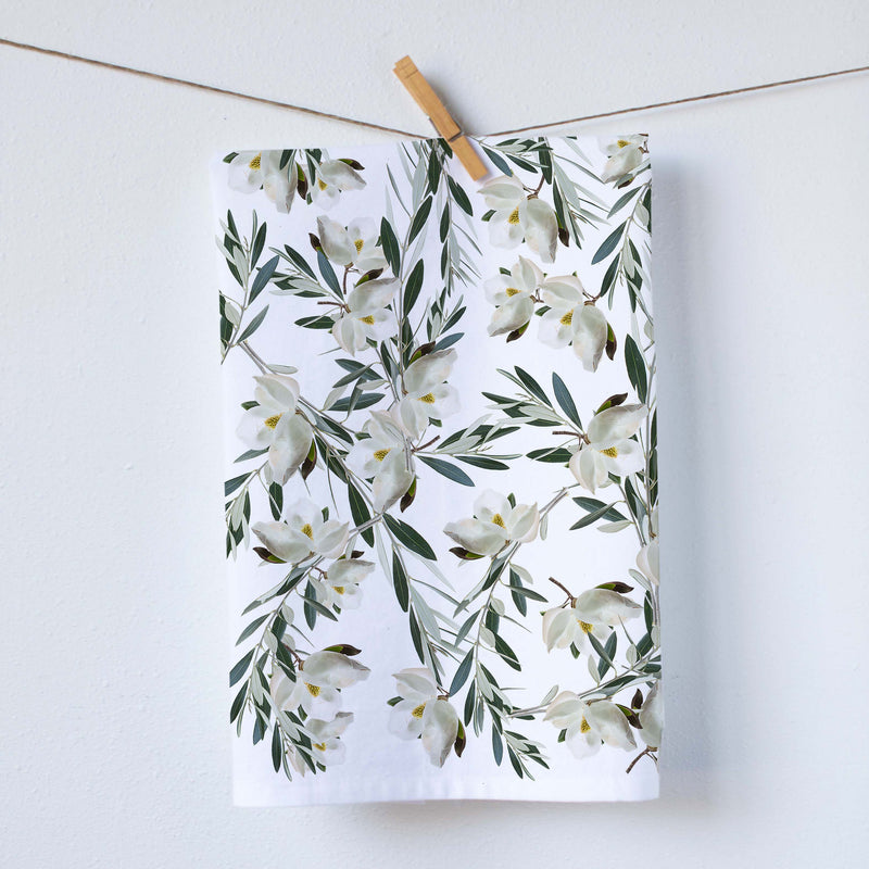 This elegant kitchen towel features arrangements of magnolias in shades of off white and green, adding a touch of sophistication to any kitchen.   Our dish towels are a perfect combination of style and practicality.  Size: 19"x 28" Print size 16"x18" 100%  Cotton Gift Ready Packed Machine wash  Exclusively at Red BIrd's House Copyright owned by Pauline Stevens.