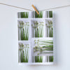 A beautiful 100 % cotton kitchen towel printed with a photo collage of onion blooms.  Green and white colors in a graphic design by Pauline Stevens (7857278484703)