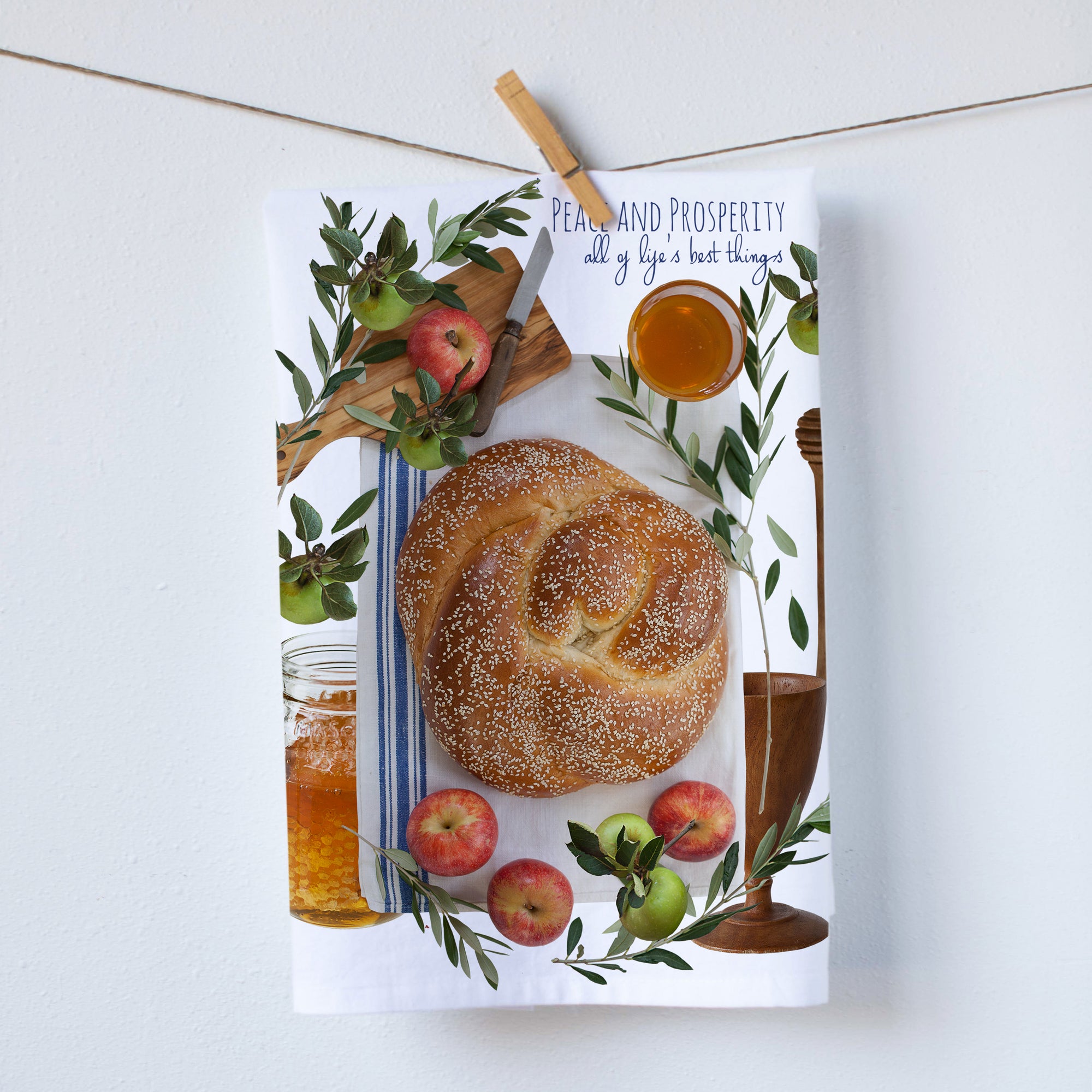Peace and Prosperity kitchen towel. Bread as well as honey and red apples are shown. Reflecting prosperity and peace. Photos by Pauline Stevens. Hostess gift, 19" x 29" (8101785537)